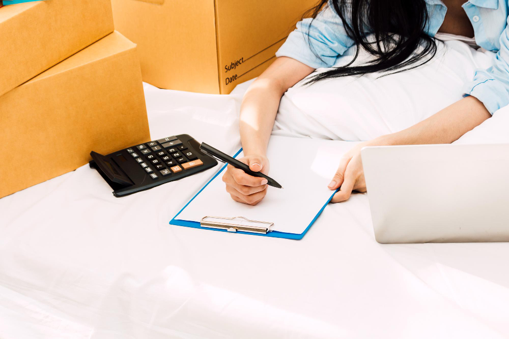 woman making a moving checklist for upcoming move in westminster colorado