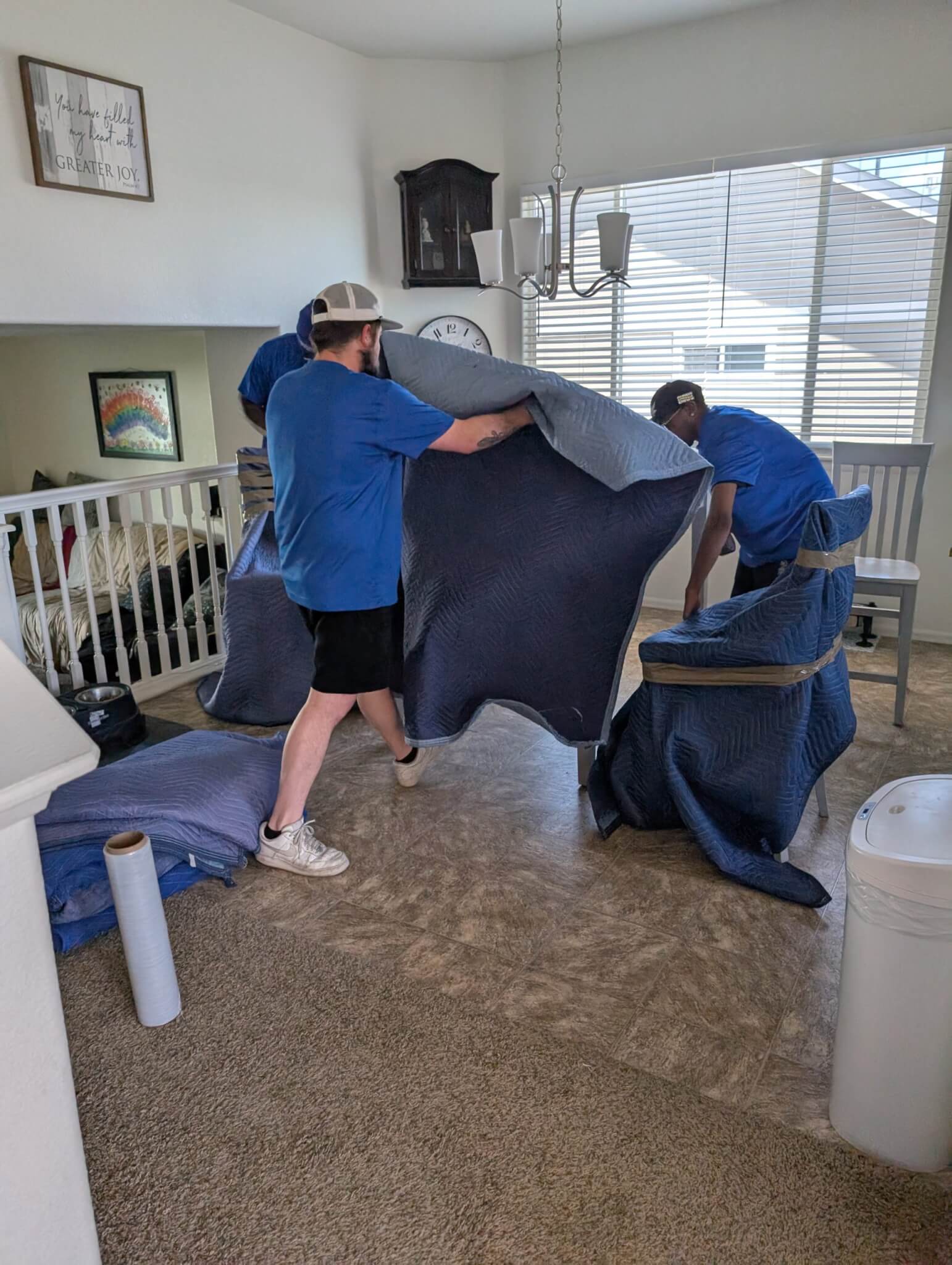 Your Neighbors movers carefully wrapping and protecting furniture before transport in the Denver metro.